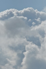 Puffy clouds against a blue sky. Beautiful, sunny weather.