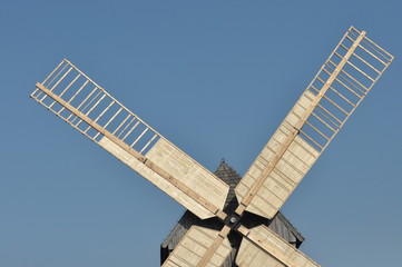 Wooden windmill. Monument. Antique mill powered by the wind
