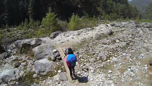 Rear view of female mountaineer. High speed camera,slow motion