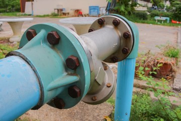 Fototapeta na wymiar Water valve Plumbing Steel on grass. industrial tap water pipe 