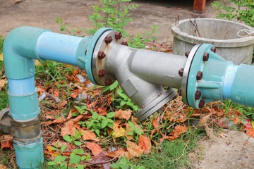 Water valve Plumbing Steel on grass. industrial tap pipe 