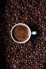 Turkish coffee on coffee beans background