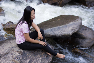 Thai woman with Mae Ya waterfall, Chiangmai Thailand