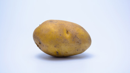 Raw potato on white background isolated.