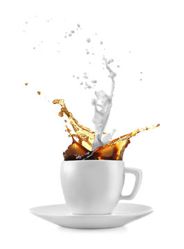 Cup with milk and coffee splashes on white background