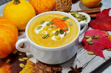 spicy pumpkin soup in a white bowl, selective focus
