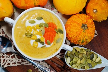 spicy pumpkin soup in a white bowl, selective focus
