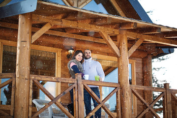 Young couple looking at distance from terrace.