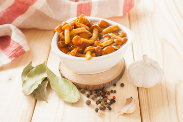 mushrooms in a bowl on a table, selective focus