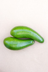 Pair of raw avocados lay on gray background. Yin yang harmony