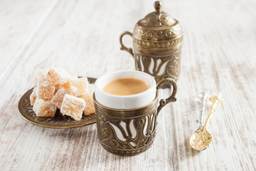 Obraz na płótnie Canvas coffee and the Turkish delight on a table, selective focus
