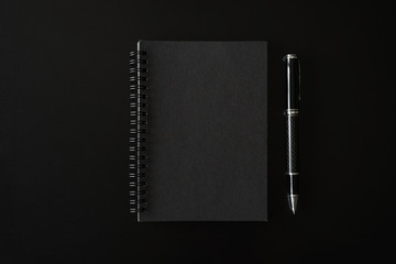Black notebook with copyspace on black background