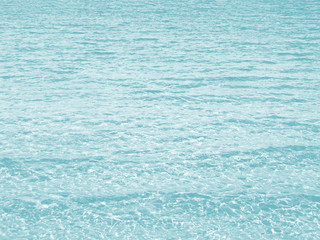 Water background. Light turquoise or light blue colored.