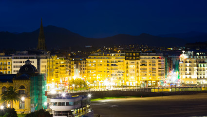 Fototapeta na wymiar View of La Concha Embankment in night at San Sebastian