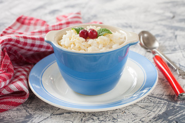 millet rice porridge in a bowl on a table, selective focus