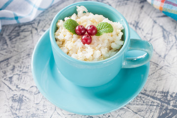 millet rice porridge in a bowl on a table, selective focus