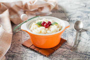 millet rice porridge in a bowl on a table, selective focus