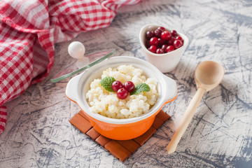 millet rice porridge in a bowl on a table, selective focus