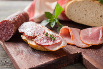 the cut sausage on a table, selective focus