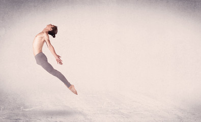 Obraz na płótnie Canvas Modern ballet dancer performing art jump with empty background