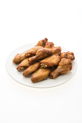Grilled bbq chicken wing in white plate