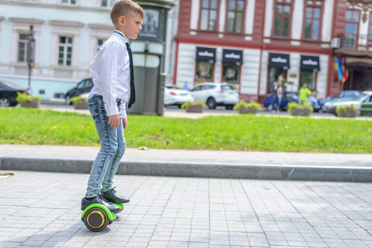 Stylish young boy riding a hover board