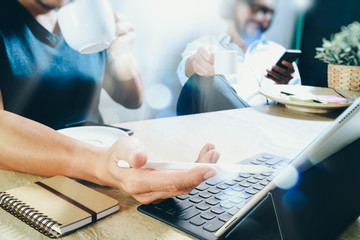 co working website designers working at office and holding a cup