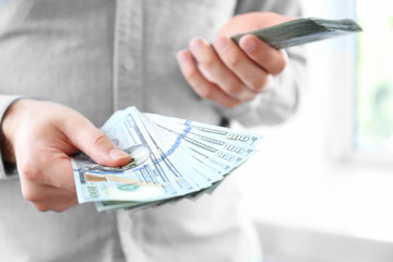 Man holding stack of money, closeup