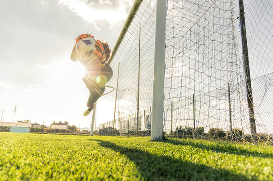 Fototapeta Goalkeeper catches the ball at the stadium 