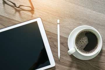 Obraz na płótnie Canvas Coffee cup and Digital table dock smart keyboard,eyeglasses,styl