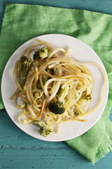 Pasta with broccoli on plate above view