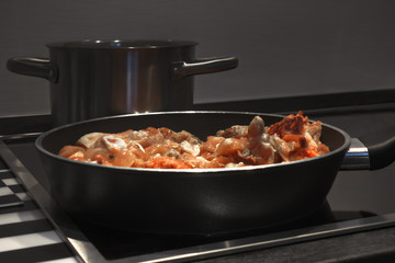 Chicken meat in frying pan