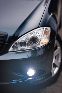 headlights of dark blue car.