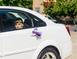 Young bride arriving for the ceremony