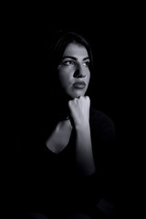 Young woman ,studio portrait on black background