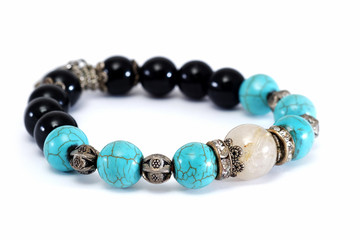 Rutile Quartz,Turquoise, Black Spinel Lucky stone bracelet with withe isolated background