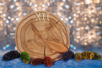 Larch saw cut in the form of dial with arrows and painted fir co