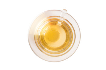 Green tea in a glass cup. On white, isolated background.