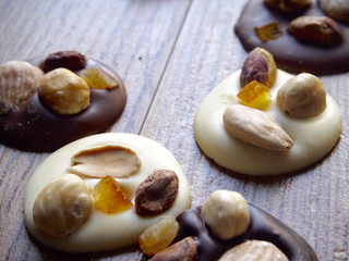 Pieces of black, white and chocolate with milk