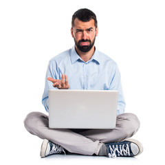 Tired man with laptop