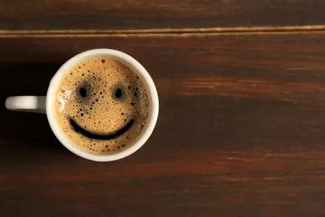 Zelfklevend Fotobehang Good morning coffee smile cup on wooden background © paulovilela