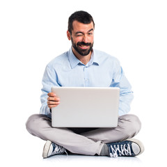 Man with laptop with stomachache