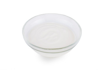 Sour cream in a saucer. On white, isolated background.