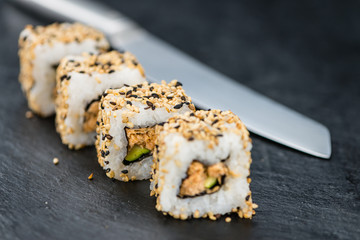 Slate slab with some Sushi (selective focus)