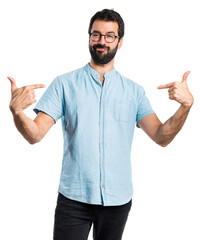 Handsome man with blue glasses proud of himself