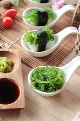 Sushi roll and seaweed salad is delicious.