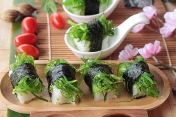 Sushi roll and seaweed salad is delicious.