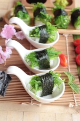 Sushi roll and seaweed salad is delicious.