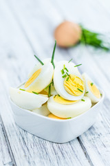Halved Eggs on wooden background