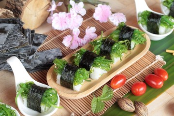 Sushi roll and seaweed salad is delicious.